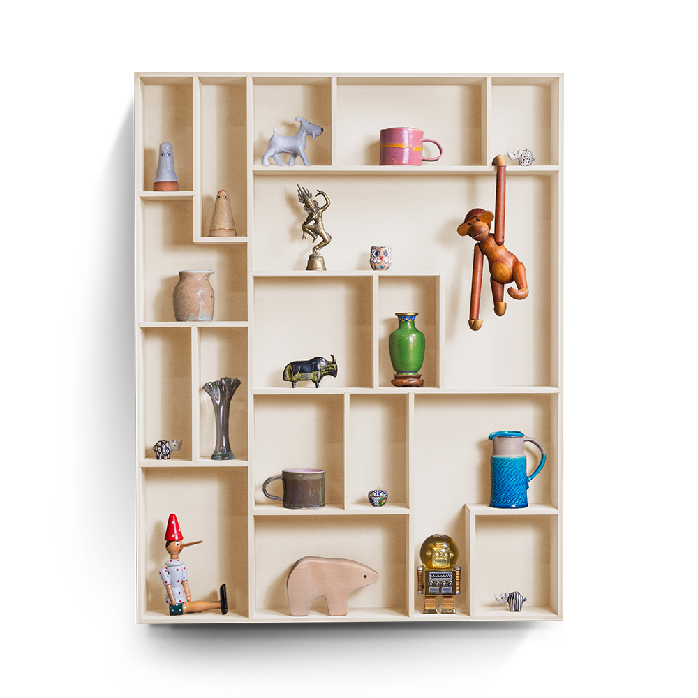 NicNac Tall decorative wall shelf in beige with multiple compartments displaying various small decorative items.