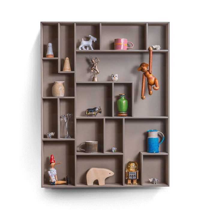 decorative wall shelf with playful compartments showcasing small treasures