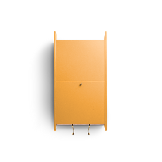 Space-saving cabinet with upward-gliding doors in orange Valchromat®.