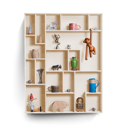 NicNac Tall decorative wall shelf in beige with multiple compartments displaying various small decorative items.