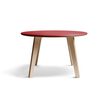 Birch dining table with vibrant Valchromat top and minimalist Scandinavian design.