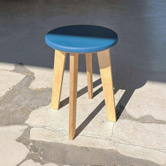 Outlet: Bjørk Stool in size regular with blue seat and wooden legs in excellent condition