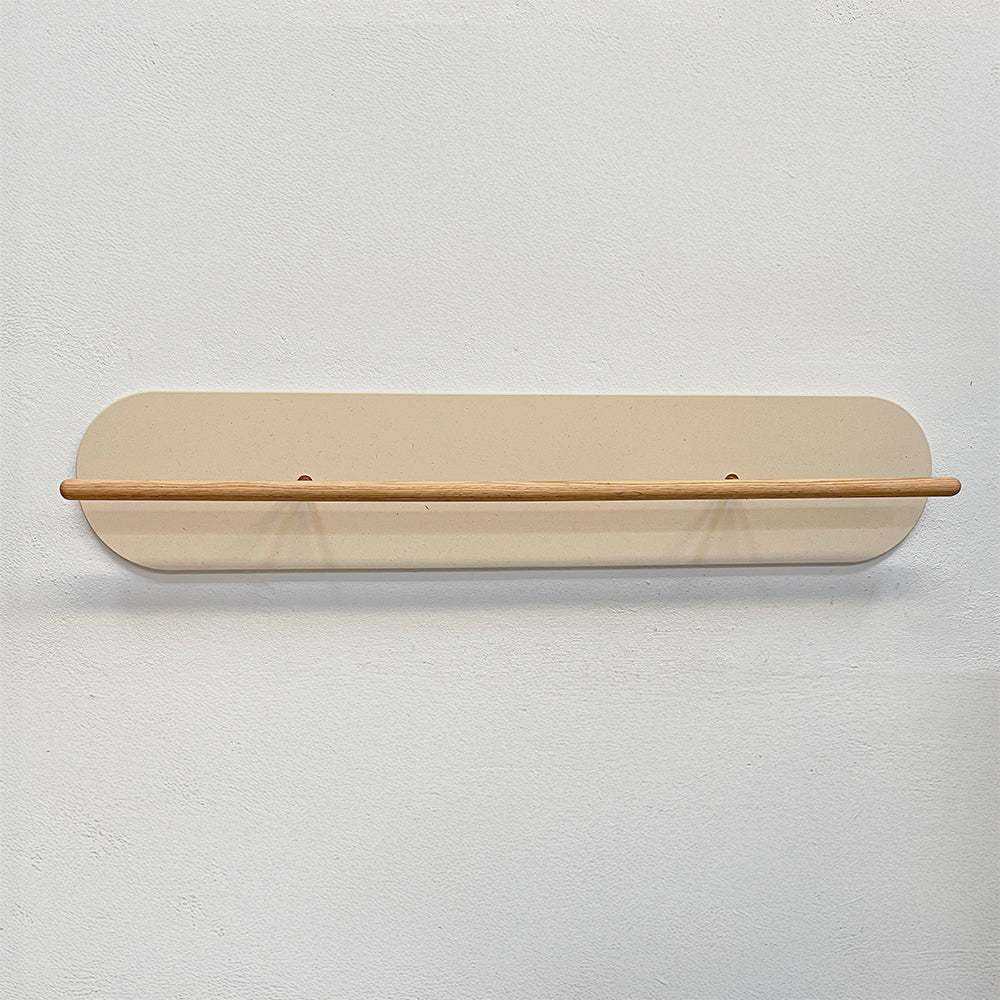 Minimalist Grounded 100cm wall-mounted shoe rack in pearl with wooden bar and smooth rounded edges