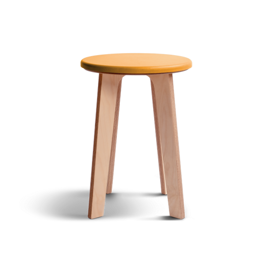 Birch stool with natural wood legs and vibrant yellow Valchromat top, showcasing minimalist Nordic design.