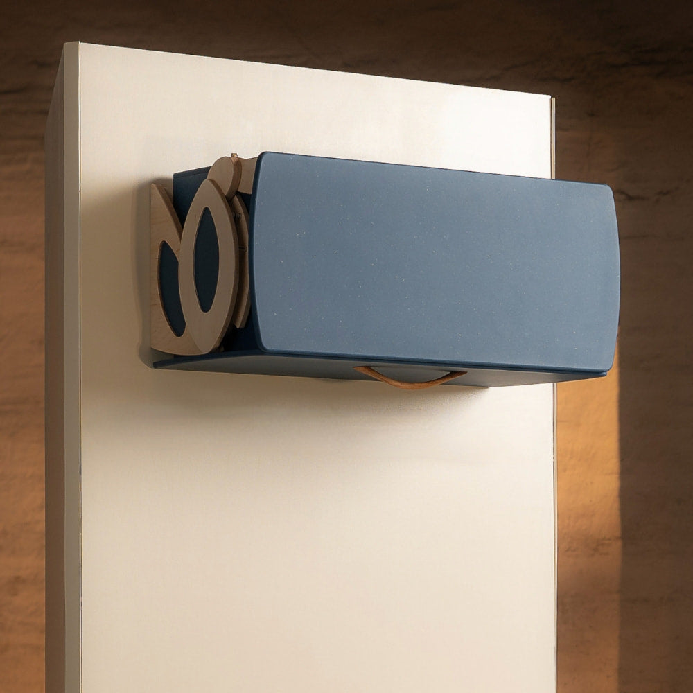 Side view of Levitate Signature wall cabinet in blue Valchromat® showing pull-down mechanism, door closed