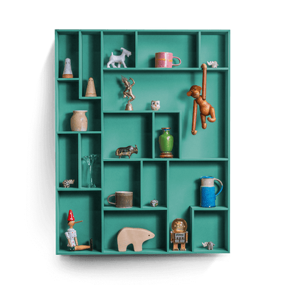 decorative wall shelf with colorful compartments displaying various treasures