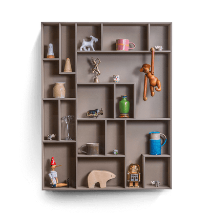 decorative wall shelf with playful compartments showcasing small treasures