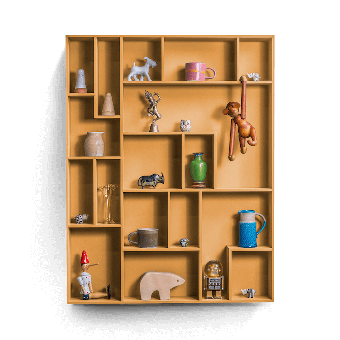decorative wall shelf with playful compartments for displaying treasures