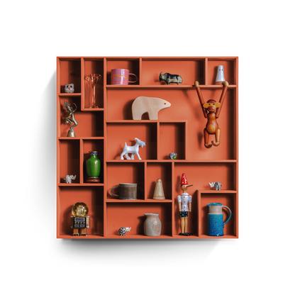 NicNac Timeless Box Shelf in orange, front view with defined compartments and small collectibles